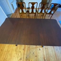 Vintage dining table with four upholstered chairs. Table is extendable. 

There is some wear and tear to the table top and could use a bit of TLC, but it is minimal. Otherwise in a good and sturdy condition. Chairs are also jn good condition, some light staining to the fabric. 

Table dimensions: L: 66in (including extension, 48in without) W: 33in, H: 29.5in