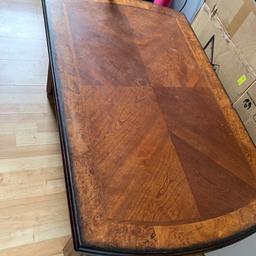Wooden coffee table with 2 stools with a football game underneath. No ball for the game. Glass top. Heavy item