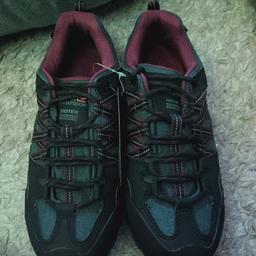New in box and tagged. Never been used or worn. Perfect condition. Walking trainers( same as boots but don't cover your ankles). Colour is black and purple. Size women's 5. Paid £45 for them originally.