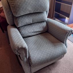 Very comfortable reclining armchair. In a patterned green fabric. Selling purely because of downsizing. £50