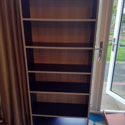 Tall bookcase in dark blue and pine style. Six shelves. Measures 164cm high, 70cm wide and 25cm deep. Only selling due to downsizing. £25