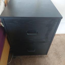 Black filing cabinet with 2 draws of files