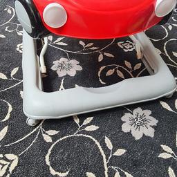 In Good condition. Red colour car shaped baby walker.