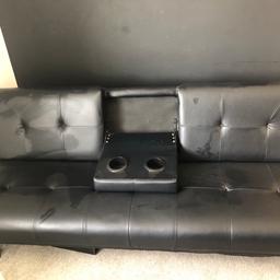 Black leather sofa bed with blue tooth speakers, power point and cup holder