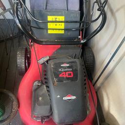 Petrol lawn mower with glass collector box