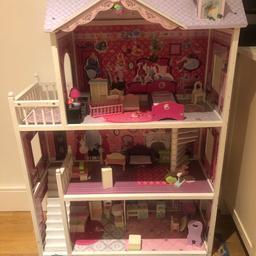 Girls dolls house, used for barbie dolls 
Comes with contents
Has lots of stickers all over it.