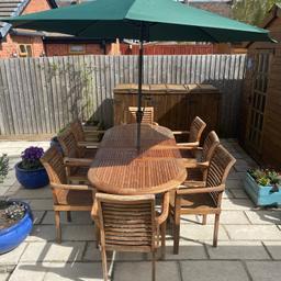 Teak used table and chairs plus 1 large crank lift umbrella the umbrella has a tilt function
 table can extend from 180cm to 240cm with two extending leafs each adding 30cm. plus stacking solid chairs
6 chairs with set £450
8 chairs £500
come with Green chair cushions not in photo's
see photo for condition can re teak oil or sand but all solid
The umbrella has a cover hardly used but the top is cracked see photo can probably be glued
will need a van for collection
Collection WR117PT
any more info please ask no time wasters please
