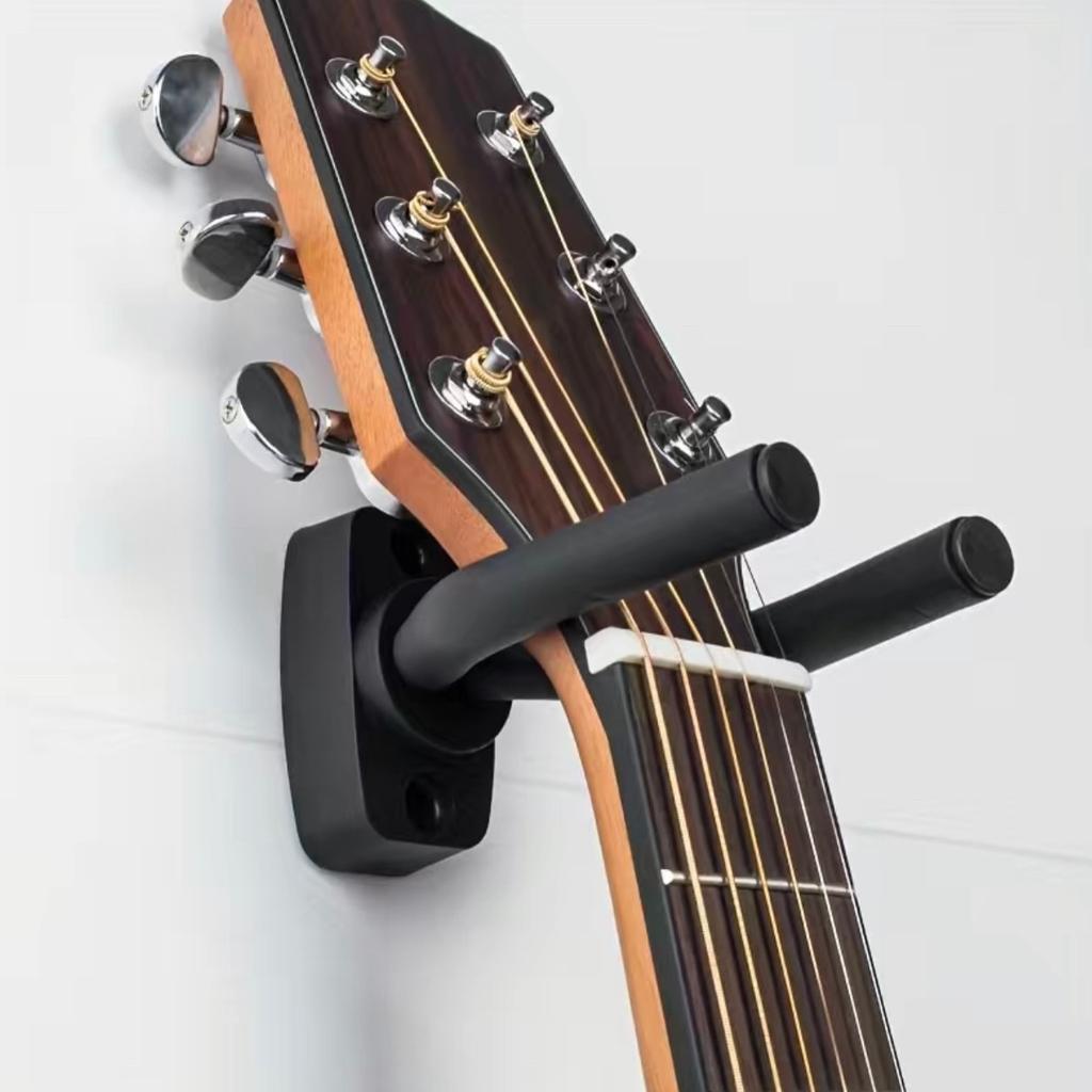 2pcs

Professionally finished guitar hanger will proudly display your guitars, banjos, basses, mandolins, and other stringed instruments and keep them safe from harm, works on all guitars! The steel hook is rated to support up to 60 pounds, Adjustable arms can be rotated to any desired angle, because it is foam coated and will not damage the finish of your instrument!

Arms are adjustable in and out to fit ALL size necks and instruments, Will hold everything from VIOLIN to BASS GUITARS and all things in between!

Great for displaying your precious instrument
Modern Style for a clean and orderly look
It can be directly screwed into walls to hang ANYWHERE

COLLECTION