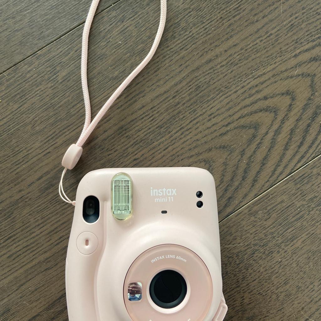 Instax mini 11 camera in pink with matching case, like new.