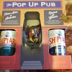pop up pub contains glass bar snacks and 2 fine ale bottles