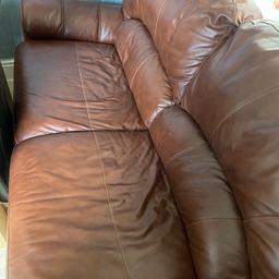 2 seater brown leather sofa with matching footstool. Good condition