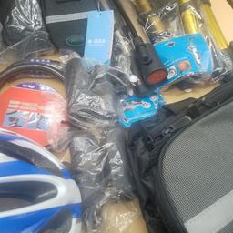joblot of cycle accessories which includes 5 small bags, 5 pumps 2 locks two handlebar covers, 1 helmet and one used bag