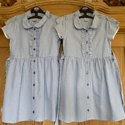Bundle of 4 girls school summer dresses 
Blue classic gingham dresses with ruffle to the front and bow at the back 
Flower shaped buttons 
Cost £12 per 2 pack 
3 age 7 / 122cm, 1 age 8 / 128cm 
Good used condition, a couple of very faint pen marks and one tiny tear at the hem of one of the dresses - please see photographs 

* FROM A SMOKE FREE HOME *

** PLEASE VIEW MY OTHER ITEMS - HAPPY TO COMBINE POSTAGE **