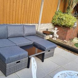 A brand new Hampshire rattan garden set,purchased today but changed mind.Can be used as 2 or 3 seater with 2 side tables and coffee table,intergrated footstools that can be pulled out and pushed back under when not in use.Perfect for the summer (if we have any 🌞) These retail at £499.99 in the range,wilkos and e-bay.Thanks for looking.