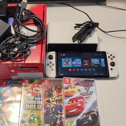 In an excellent condition and comes with box and 4 game titles.

Donkey Kong Country - Tropical Freeze
Super Mario Deluxe
Sonic Forces
Cars 3 Drive to win (downloaded)

Nintendo Oled Official Carry Case