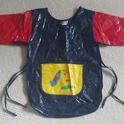 Vertbaudet kids painting apron.  100% PVC.  Little pocket at the front.  Goes over the head and ties at each side.  Excellent condition.