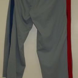 Used Item worn short periods - 4 times only so good as new and in very good condition.

Rare Vintage basketball tracksuit bottoms for Men in grey colour with red and blue side stripes. Has been washed and air dried and no need to iron.

The tracksuit bottoms are buttoned on both sides, which is a unique style in itself that can be buttoned from top to bottom or halfway. (Please see images)

Size: Medium
Height: 178
Material: 100% Polyester

Any questions please feel free to ask.

Thank you for looking 😊
