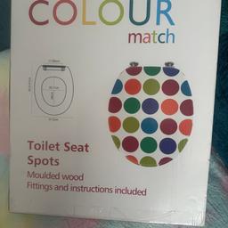 Brand new multi coloured spots toilet seat. 
Collection only from new ferry