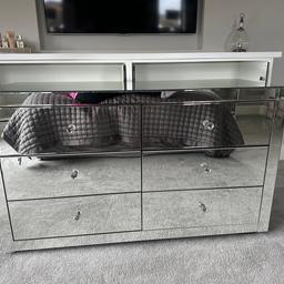 Large mirrored 6 draw chest with crystal handles
There’s a slight crack in the top right hand side. It’s hardly noticeable though as it’s a straight line. 

145cm wide
57cm deep
51cm high