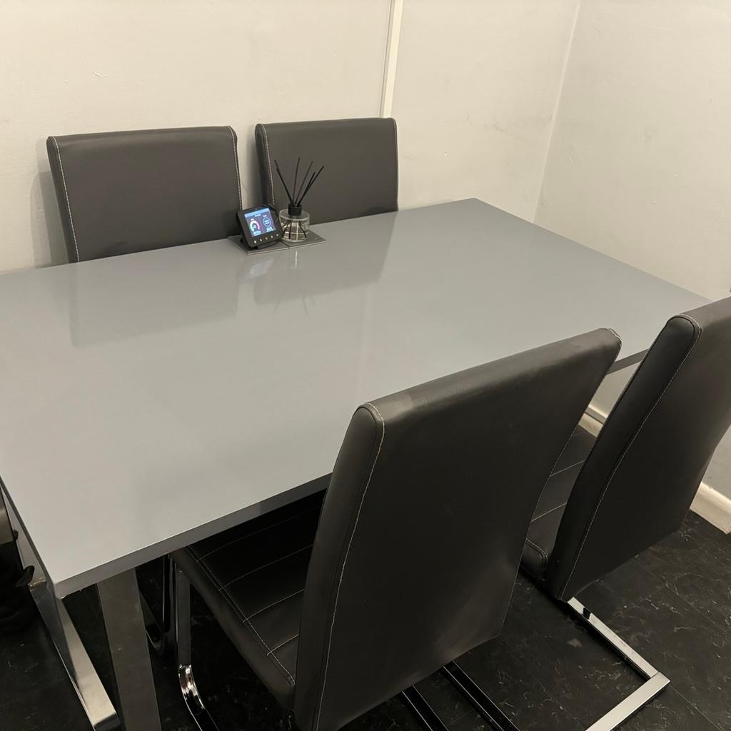 Grey and chrome dining table with 4 chairs
1 small rip on 1 chair (please see last photo)
Viewings welcome
Collection only

80 depth
140 length
76 height