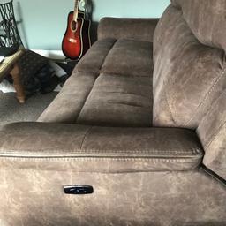 Chocolate with gold lightening strikes electric recliner sofa for sale!  We bought it for £1400!  Bought last Dec nearly new condition!  Also folds down into a semi bed!  Collection only from Morpeth!