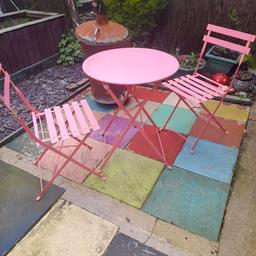 gorgeous pink bistro garden set. strong, heavy metal. can always spray if you don't like the colour. table and chairs fold flat for easy storage. table top is approx 60 cm radius and 72 cm high. the top is a little grubby where I've been painting but nothing major. pick up TS4 2SX
