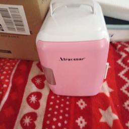 Atravesar small fridge to carry around it car got a pink door and white brand new make a offer pick up only from B13 0ES