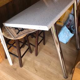 White work top breakfast bar with legs. Edging on one side will need re-gluing. 24”x 39”.