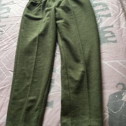 Medium weight trousers, herringbone pattern. Sage green. They look like fine wool. Not long, just ankle length. Very comfy, elastic waist. WV13 1HA area