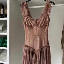 I bought off Depop a while ago and never worn since. Unsure on Color a pinky/rose gold due to the sparkle effect. 

Beautiful little playsuit that looks like a dress however never got the chance to wear.