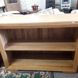 SALE - Was £210 NOW £175.

This lovely oak panelled bookcase is in good all-round used condition. Some light marks on the top but hardly noticeable... It looks like solid oak but may be a mixture of veneer too?

45.5 inches long x 13 inches deep x 33.5 inches high.

Our second hand furniture mill shop is LOW COST MOVES, at St Paul's trading estate, Copley Mill, off Huddersfield Road, Stalybridge SK15 3DN... Delivery available for an extra charge.

There are some large metal gates next to St Paul's church... Go through them, bear immediate left and we are at the bottom of the slope, up from the red steps... 

If you are interested in this or any other item, please contact me on 07734 330574, or on the shop 0161 879 9365...Many thanks, Helen. 

We are OPEN Monday to Friday from 10 am - 5 pm and Saturday 10 am - 3.30 pm... CLOSED Sundays.  CLOSED Bank Holiday long weekends...