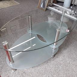 SALE - Was £30 NOW £24.

This oval clear and frosted glass & chrome tiered TV stand is in good all-round used condition... There are a few light scratches on the top glass.

39 inches long x 23 inches deep x 16 inches high.

Our second hand furniture mill shop is LOW COST MOVES, at St Paul's trading estate, Copley Mill, off Huddersfield Road, Stalybridge SK15 3DN... Delivery available for an extra charge.

There are some large metal gates next to St Paul's church... Go through them, bear immediate left and we are at the bottom of the slope, up from the red steps... 

If you are interested in this or any other item, please contact me on 07734 330574, or on the shop 0161 879 9365...Many thanks, Helen. 

We are OPEN Monday to Friday from 10 am - 5 pm and Saturday 10 am - 3.30 pm... CLOSED Sundays.  CLOSED Bank Holiday long weekends...