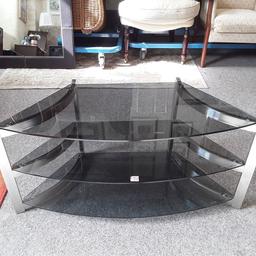 SALE - Was £45 NOW £36.

This lovely modern black and chrome curved glass TV unit is in good all-round used condition...

40 inches wide x 18 inches deep x 18.5 inches high.

Our second hand furniture mill shop is LOW COST MOVES, at St Paul's trading estate, Copley Mill, off Huddersfield Road, Stalybridge SK15 3DN... Delivery available for an extra charge.

There are some large metal gates next to St Paul's church... Go through them, bear immediate left and we are at the bottom of the slope, up from the red steps... 

If you are interested in this or any other item, please contact me on 07734 330574, or on the shop 0161 879 9365...Many thanks, Helen. 

We are OPEN Monday to Friday from 10 am - 5 pm and Saturday 10 am - 3.30 pm... CLOSED Sundays.  CLOSED Bank Holiday long weekends...