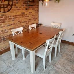 Large Solid Wood and White Ikea Dining Table with 5 White Ikea Chairs. 
Table has a black mark in the middle but other than that great table and chairs. Would benefit from a touch up with paint on some bits. 
Table size 100cm x 180cm.