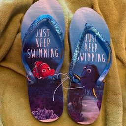 Brand new ladies finding nemo flip flops size 5-6 ladies paper tag removed but still attached
