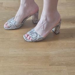 mules in snake pattern 
heels height 8 cm
size uk 4
in a very good condition