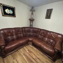 Maroon leather corner sofa. Have some mild wear and tear can be easily fixed. Absolutely stunning still very comfortable. 100% pure solid leather with wooden base bought from SCS with receipt many years ago and still looks great. Am open to negotiation but be reasonable. I will give FREE hexagonal wooden and glass stunning coffee table with this purchase.