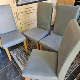 4 Grey faux leather dining chairs with wooden legs 
Good condition