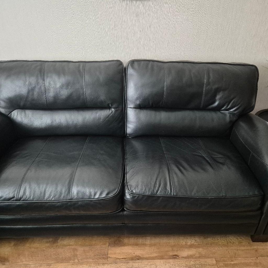hello we have this large black leather sofa for sale it's a 3 seater just 2 large seats it's in absolutely perfect condition viewing more than welcome (widnes)