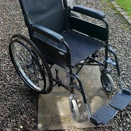 Sturdy, black, self propelled wheelchair for sale. Hardly used. Easy to foldaway, and has foot rests and straps/belt.