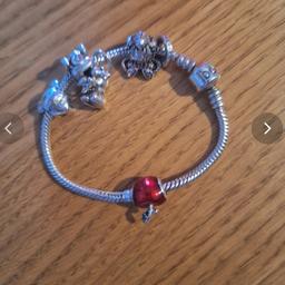 Children's Pandora bracelet with 5 charms of which 3 are Disney Minnie mouse. Used but still in good condition.