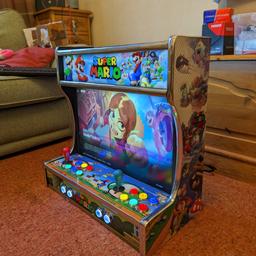 wall mounted arcade machine 

brand new wall mount arcade machine.ade by gitto gaming 

12000 games
brackets supplied for easy wall mounting 
led buttons 
22 inch screen
light up marquee 

******in stock now******