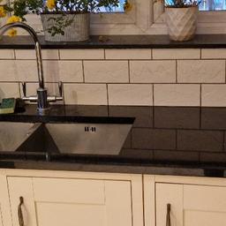 granite black with gold sparle worktop. 
Good condition. 
space for double sink 

length 3metres 
depth 62.5cm 

sink space 82cm by 39cm 

1 smaller piece of granite work window sill 
length 185cm 
depth 22.5cm