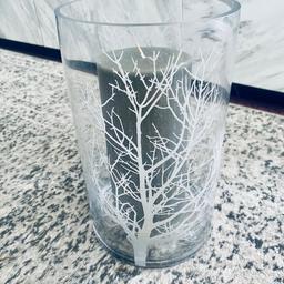 Next Tree hurricane candle holder vase
Clear vase with tree detail comes with large grey shimmer candle- never lite.
Dimensions: vase width 15cm x height 25.5cm approx
Candle width 8.5cm x height 20cm.
No branded markings on the vase.

COLLECTION SHILDON OR CAN POST FOR £5. BT! Weight is over 3kg.