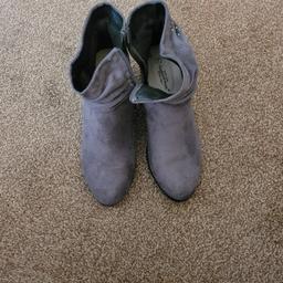 Beautiful stylish comfy ankle boots.  Relatively small heel. in great condition.  Cushioned soles for extra comfort.