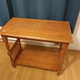 Brown wooden table with a lower shelf. Perfect as a side table.