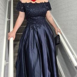 Navy Blue Prom/Bridesmaid Gown, Built in Bra and Zip up back.

UK Size 14. Worn once for a couple of hours. Comes With Bag it came in.