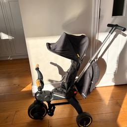 Please Google for pics/spec information.

Doona Liki s5 trike, gutted to be selling this but my 4 year old will walk everywhere now. So handy for the school run, folds right down into cabin size for trains/planes etc. includes the bag which can be used as a rucksack. 

I can’t find the plastic bumper bar unfortunately but the seat has straps to hold your child in. We took the bumper off as she didn’t need it. 

Good used condition, little piece missing in the yellow plastic on the handle and a little hole in the seen of the hood. (See pics) welcome to come and test/view before buying.  Paid over £250 new.

-The smallest folding trike in the market 
-Folds and unfolds in seconds 
-Features sleek, urban design, offering maximum functionality and comfort 
-Easy to navigate by parent and child with a dual steering system 
-Easy to carry and store Ideal for travel - easily fits in the boot of your car or the airplane’s overhead bin
-Highly durable soft-ride wheels 
-UV protection canopy