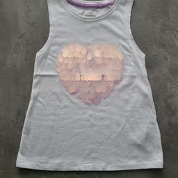 Girls white, sleeveless, large sequinned heart tshirt. Next age 8yrs. Good condition.  Free collection Derby area or can post for additional postage fee of £3.35.