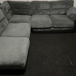 Corner sofa with extra seat/foot rest.